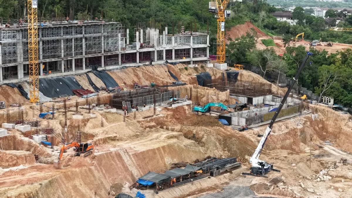 Construction site showing structural works for water reservoirs at resort buildings, used as context for a Phuket off-plan project due diligence checklist Construction site showing structural works for water reservoirs at resort buildings, used as context for a Phuket off-plan project due diligence checklist