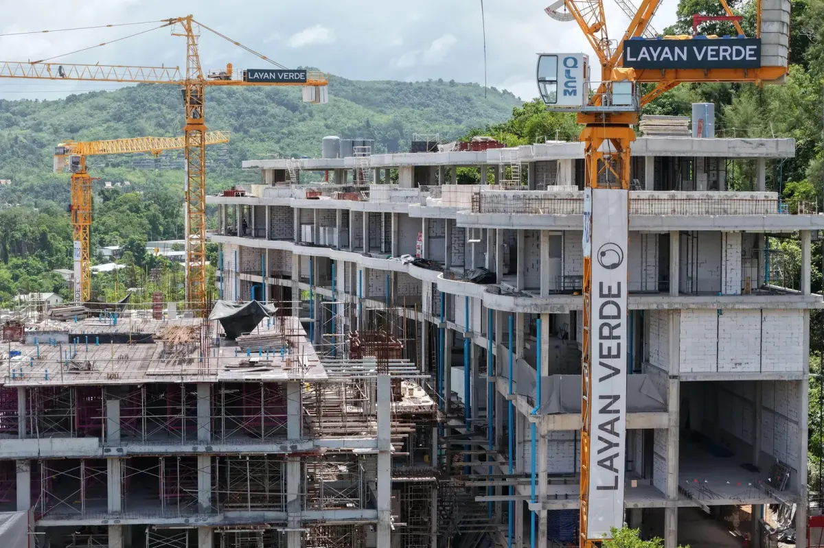 Construction progress on interior walls of a multi-storey Phuket condominium building