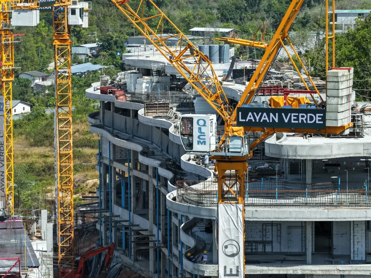 Construction progress on interior walls of a mid‑rise condo building at Layan Verde in Phuket