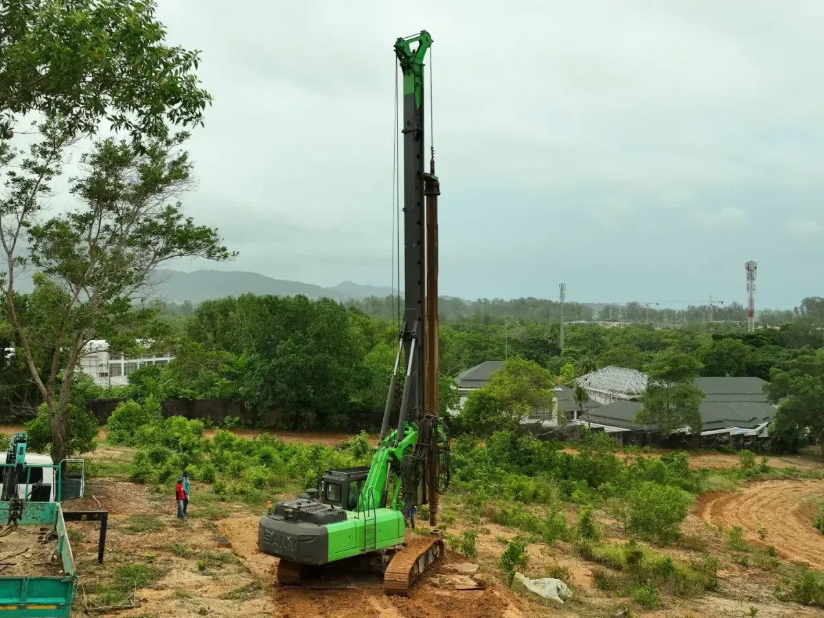 Construction site in Thailand with workers preparing foundations and conducting pile tests Construction site in Thailand with workers preparing foundations and conducting pile tests