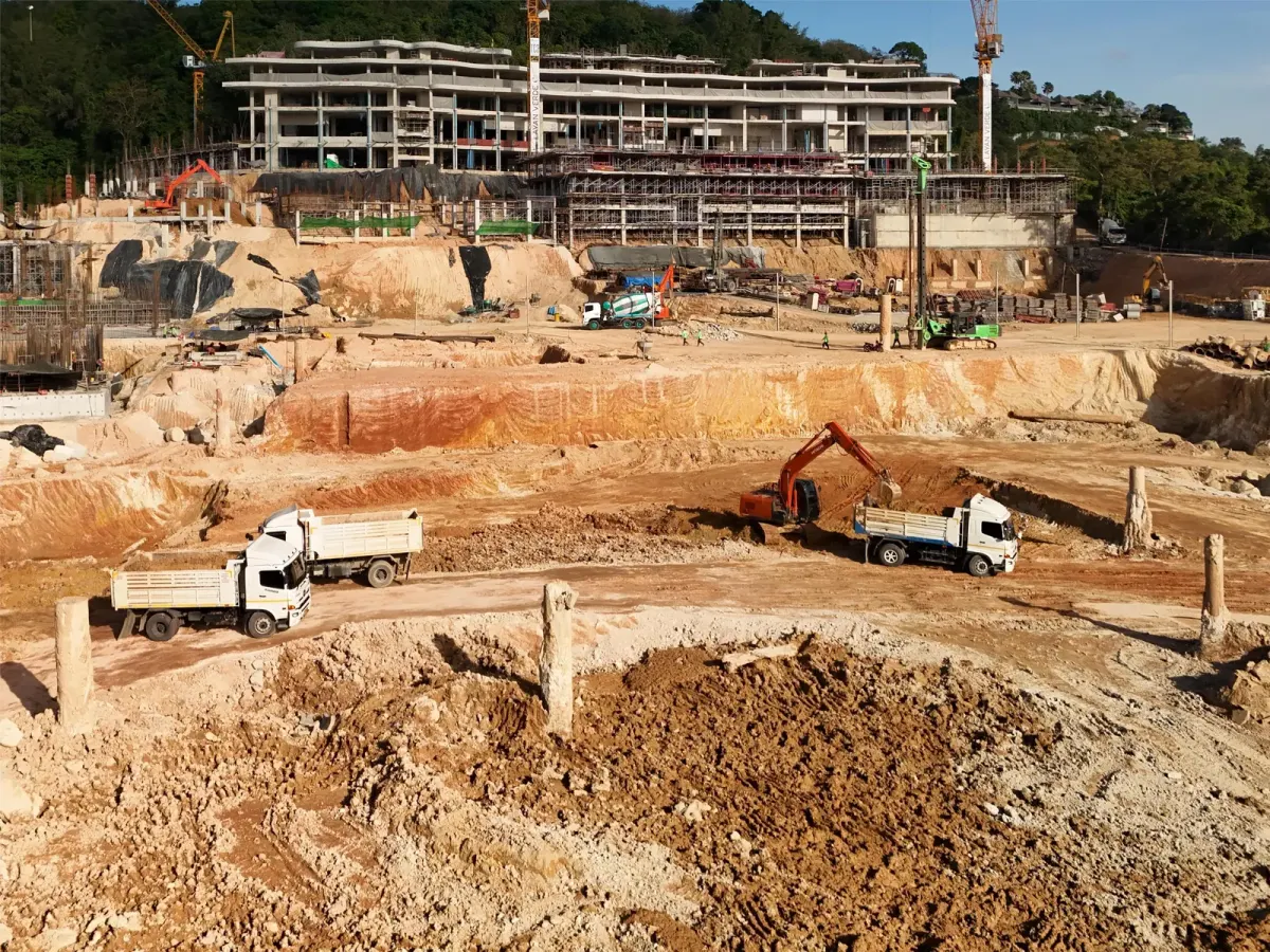 Construction site with soil excavation work at phase two of a Phuket property development Construction site with soil excavation work at phase two of a Phuket property development
